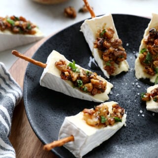 Adorable Brie cheese bites topped with caramelized walnuts. Try also the Brie Christmas tree appetizer version for the holidays.