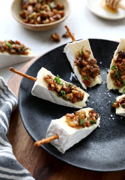 Adorable Brie cheese bites topped with caramelized walnuts. Try also the Brie Christmas tree appetizer version for the holidays.