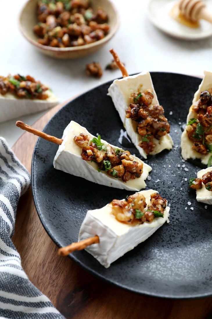 Adorable Brie cheese bites topped with caramelized walnuts. Try also the Brie Christmas tree appetizer version for the holidays.