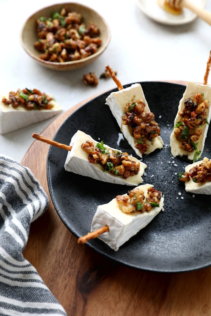 Adorable Brie cheese bites topped with caramelized walnuts. Try also the Brie Christmas tree appetizer version for the holidays.