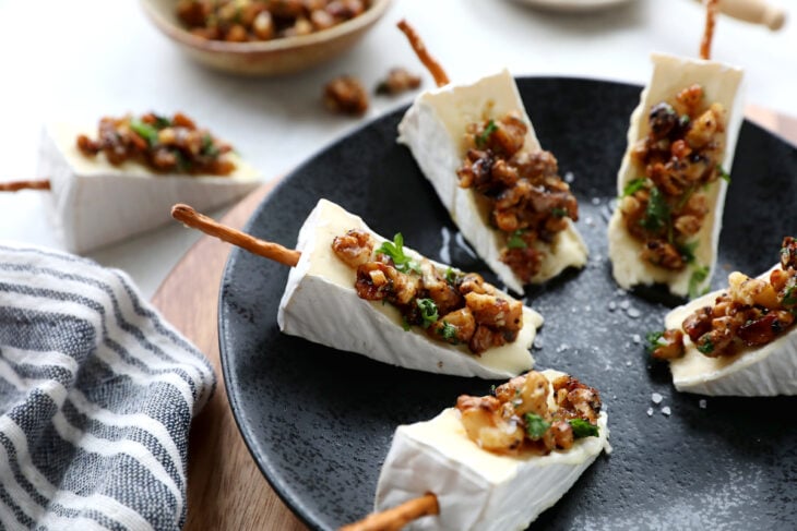 Adorable Brie cheese bites topped with caramelized walnuts. Try also the Brie Christmas tree appetizer version for the holidays.