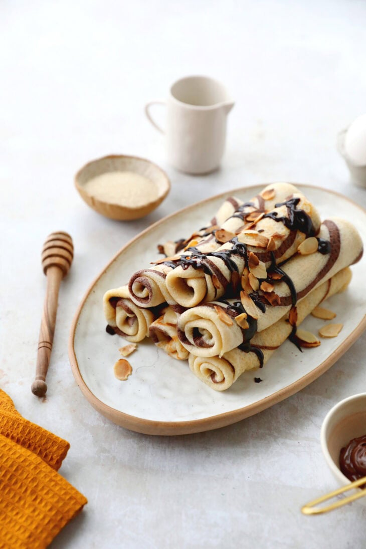 Learn how to make chocolate swirl crepes (zebra crepes). Prepared with a two-tone batter, these chocolate and vanilla crepes are super fun!
