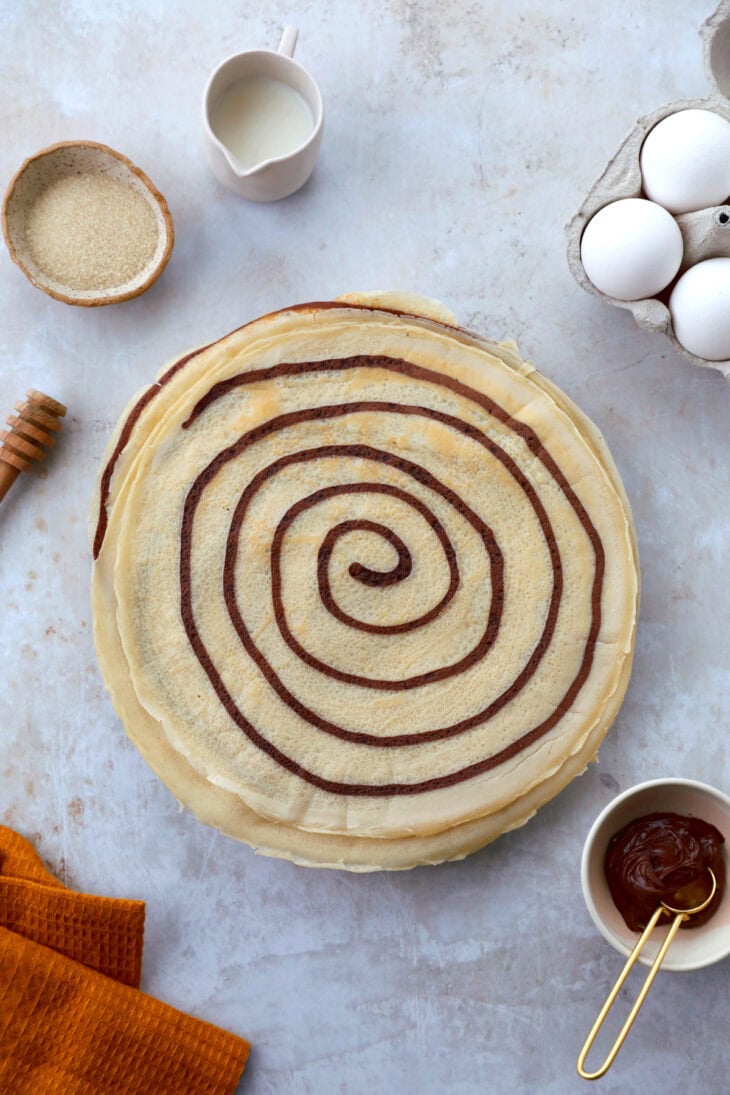 Learn how to make chocolate swirl crepes (zebra crepes). Prepared with a two-tone batter, these chocolate and vanilla crepes are super fun!