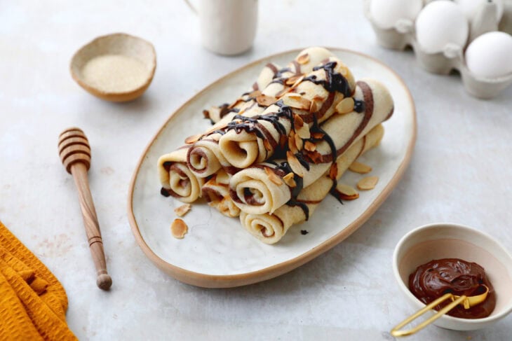 Learn how to make chocolate swirl crepes (zebra crepes). Prepared with a two-tone batter, these chocolate and vanilla crepes are super fun!