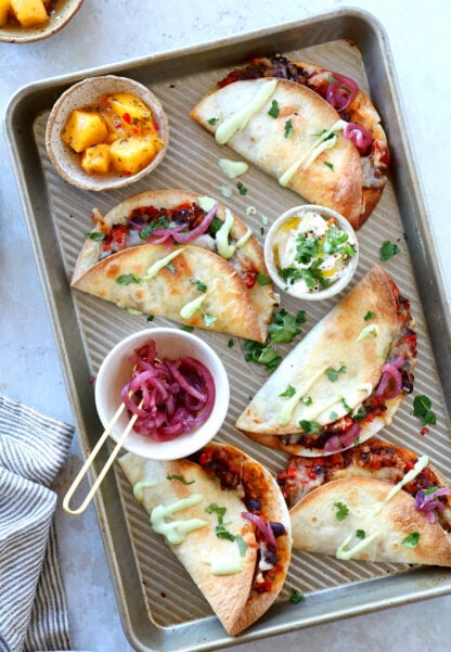 These crispy oven black bean tacos are vegetarian and packed with flavors. Ready in just 30 minutes, they are perfect to feed a crowd.