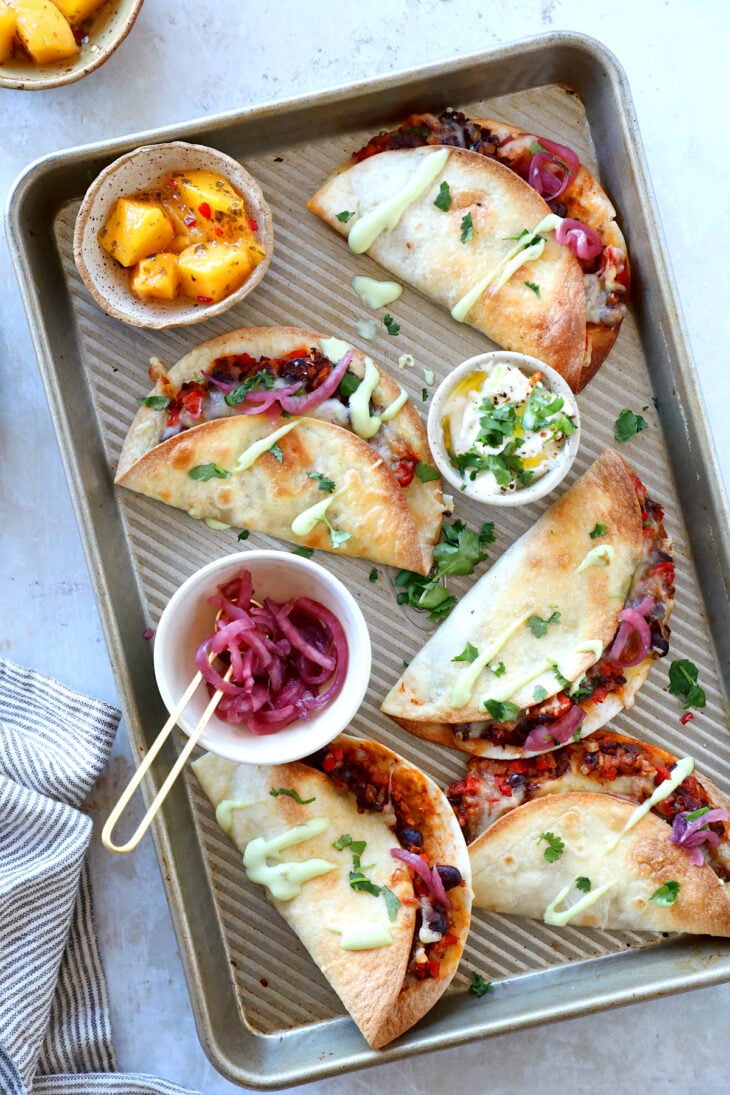 These crispy oven black bean tacos are vegetarian and packed with flavors. Ready in just 30 minutes, they are perfect to feed a crowd.