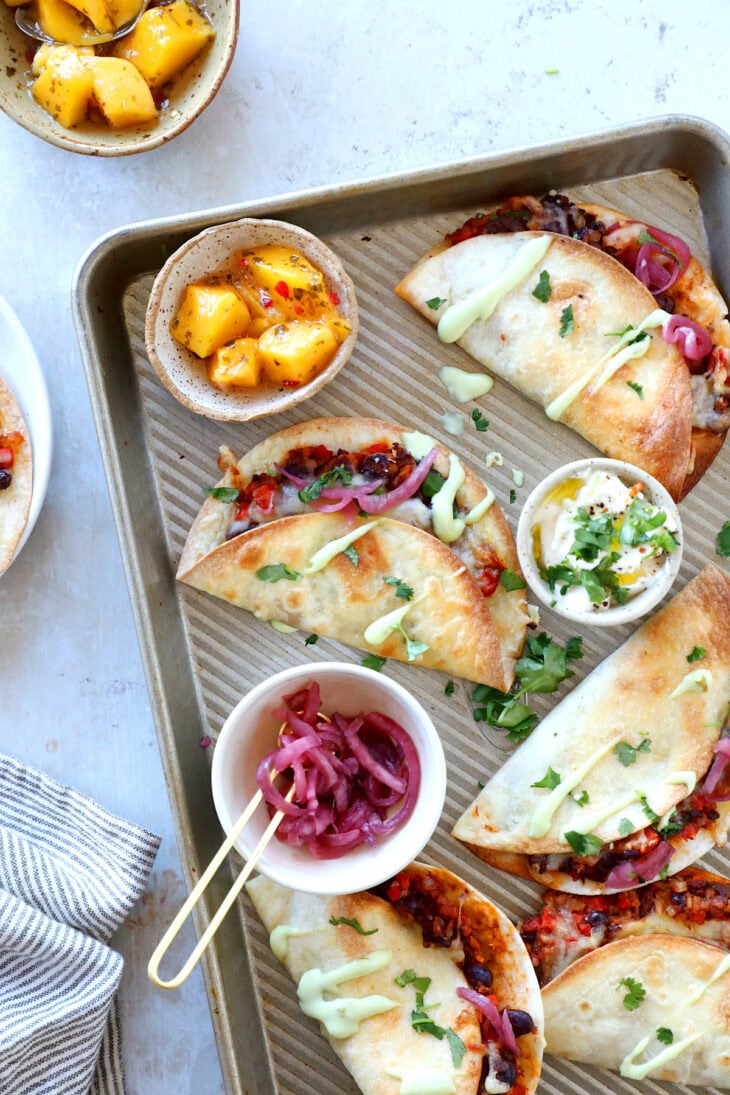 These crispy oven black bean tacos are vegetarian and packed with flavors. Ready in just 30 minutes, they are perfect to feed a crowd.