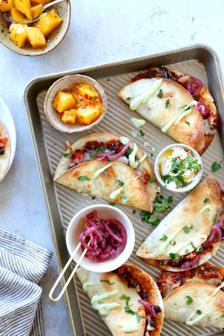 These crispy oven black bean tacos are vegetarian and packed with flavors. Ready in just 30 minutes, they are perfect to feed a crowd.