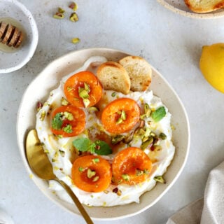 Honey-roasted apricots with whipped ricotta, brown butter and toasted pistachios makes for a simple and elegant summer dessert.