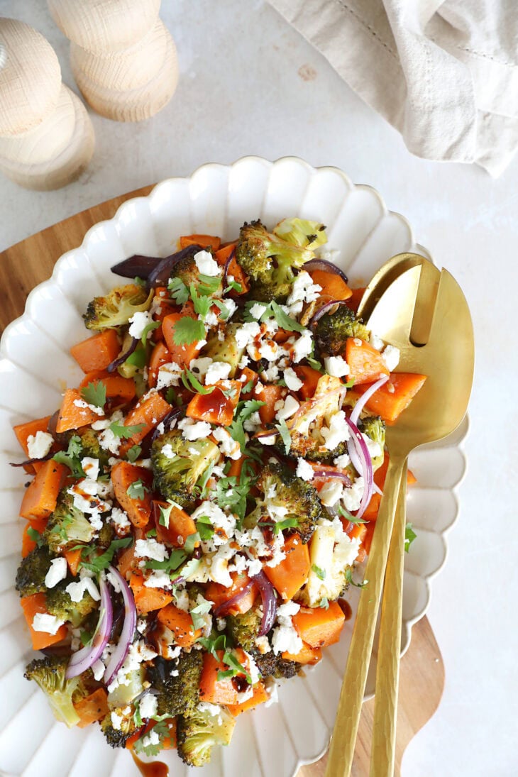 Oven-roasted broccoli and sweet potatoes with feta is a simple veggie side dish loaded with flavors. Ready in only 30 minutes in the oven!