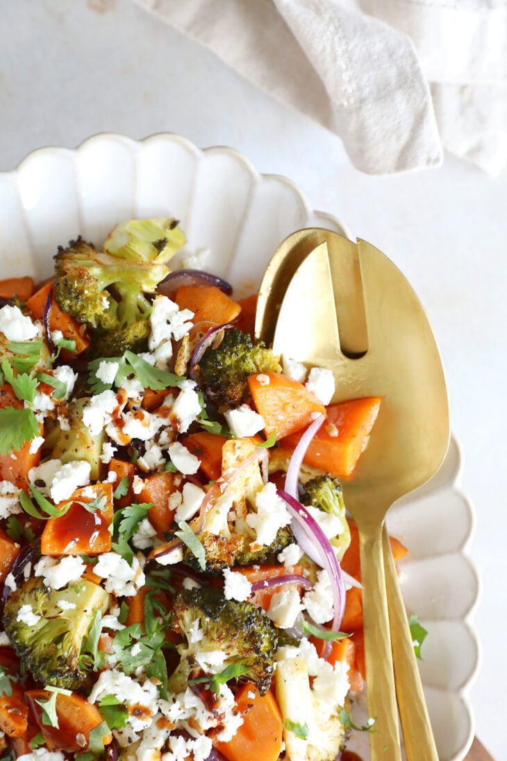 Oven-roasted broccoli and sweet potatoes with feta is a simple veggie side dish loaded with flavors. Ready in only 30 minutes in the oven!