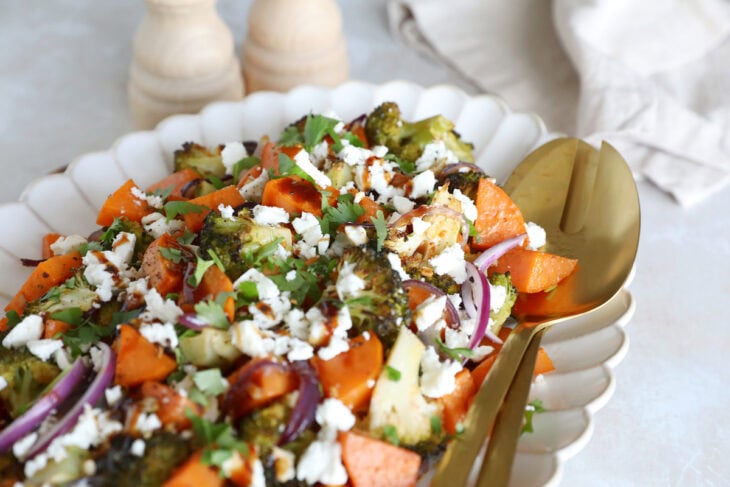 Oven-roasted broccoli and sweet potatoes with feta is a simple veggie side dish loaded with flavors. Ready in only 30 minutes in the oven!