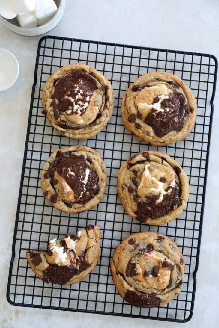 These utterly decadent s’mores chocolate chip cookies are inspired by those nostalgic campfire s’mores and made into a bakery-style dessert.